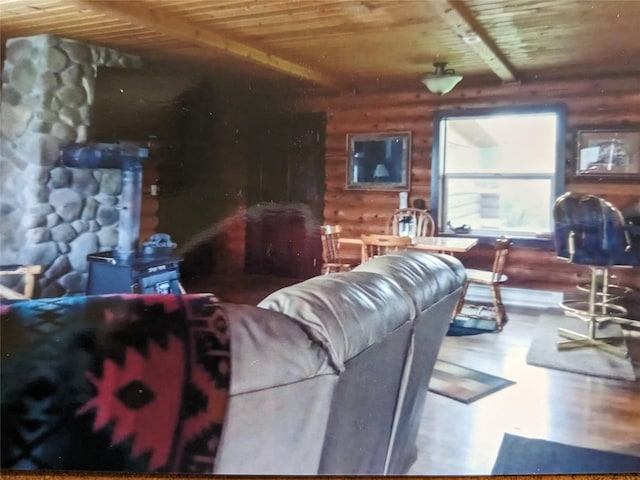 240 Ponderosa Rd, Melrose, MT 59743 - living room featuring wooden ceiling, wood finished floors, wooden walls, and a wood stove