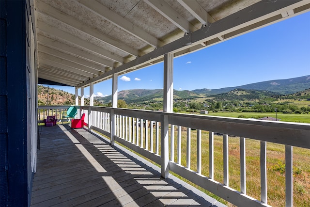 wooden terrace featuring a mountain view