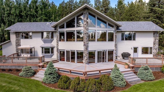 back of house with a wooden deck