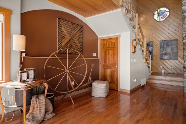 417 Sirucek Ln, Kalispell, MT 59901 - sitting room with stairs, hardwood / wood-style floors, wooden walls, wooden ceiling, and vaulted ceiling