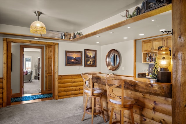 417 Sirucek Ln, Kalispell, MT 59901 - indoor wet bar with log walls, carpet floors, recessed lighting, and decorative light fixtures