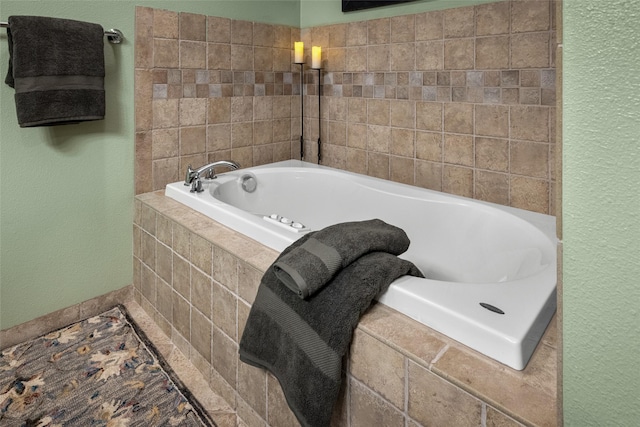 417 Sirucek Ln, Kalispell, MT 59901 - bathroom featuring a garden tub and a textured wall