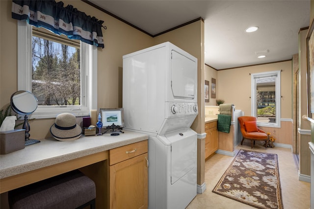 417 Sirucek Ln, Kalispell, MT 59901 - washroom with stacked washing machine and dryer, ornamental molding, and recessed lighting