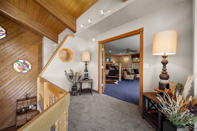 417 Sirucek Ln, Kalispell, MT 59901 - hallway with carpet flooring, a wooden ceiling with exposed beams, and wood walls