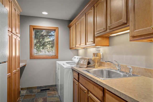 417 Sirucek Ln, Kalispell, MT 59901 - washroom with washing machine and dryer, cabinet space, dark stone finish floors, and recessed lighting