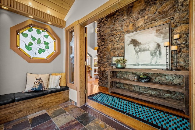 417 Sirucek Ln, Kalispell, MT 59901 - foyer with stone tile flooring, arched walkways, and vaulted ceiling