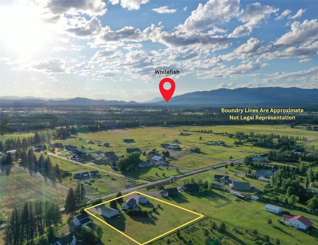 drone / aerial view featuring a mountain view