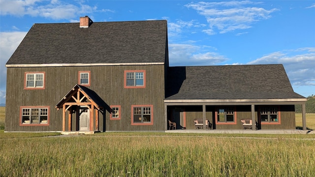 285 N Hill Rd, Kalispell, MT 59901 - view of front of home with a chimney and a shingled roof