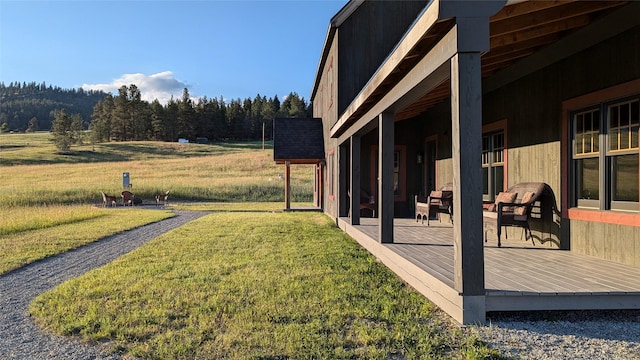 285 N Hill Rd, Kalispell, MT 59901 - view of green lawn with a deck