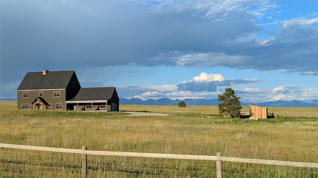 285 N Hill Rd, Kalispell, MT 59901 - view of yard featuring a view of rural / pastoral area, a mountain view, and an outdoor structure