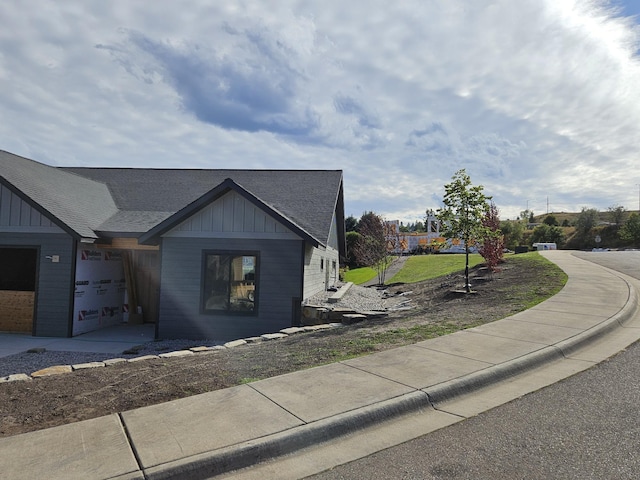 view of side of home featuring a garage