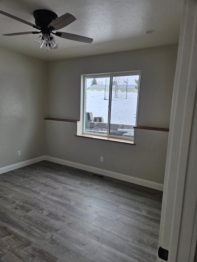 unfurnished room featuring hardwood / wood-style floors and ceiling fan