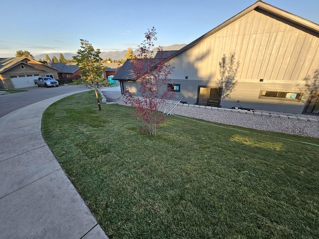 view of property exterior with a yard