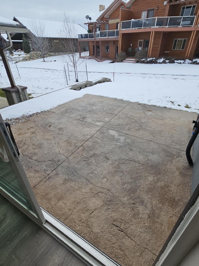 view of snow covered patio