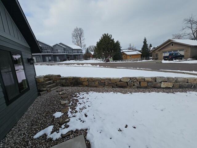 view of yard layered in snow