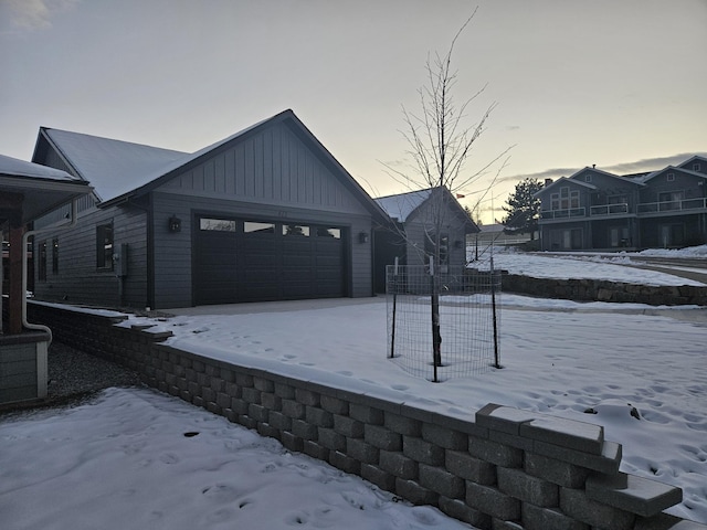 view of snow covered garage