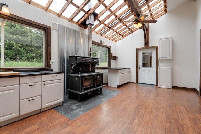 96 S Sanctuary Loop, Heron, MT 59844 - kitchen featuring wood finished floors, white cabinetry, dark countertops, and ceiling fan