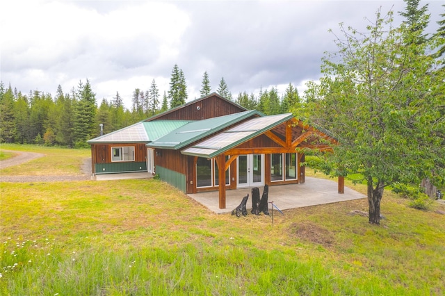 96 S Sanctuary Loop, Heron, MT 59844 - back of property with a patio area, a yard, french doors, and metal roof