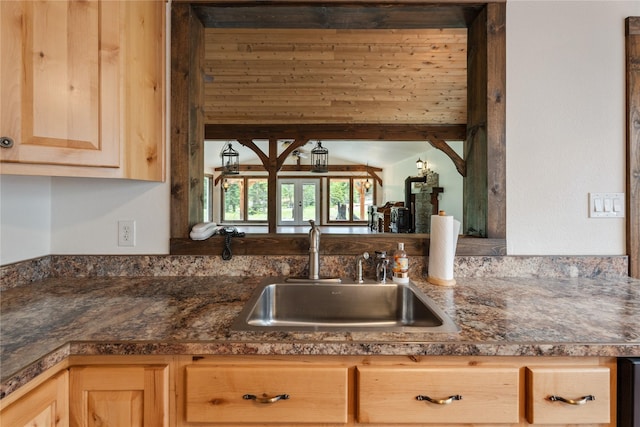 96 S Sanctuary Loop, Heron, MT 59844 - kitchen featuring light brown cabinetry, a sink, and dark countertops