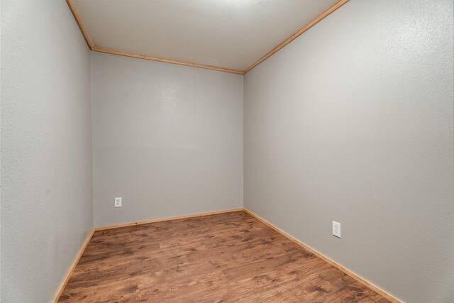 96 S Sanctuary Loop, Heron, MT 59844 - unfurnished room featuring ornamental molding, wood finished floors, and baseboards