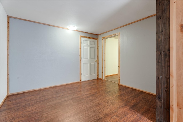96 S Sanctuary Loop, Heron, MT 59844 - spare room featuring crown molding, wood finished floors, and baseboards