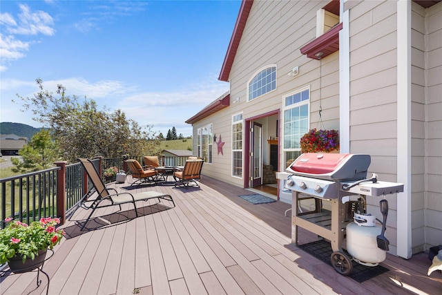 wooden deck with grilling area