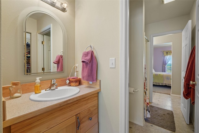 bathroom featuring tile patterned floors and vanity