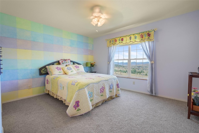 bedroom featuring ceiling fan and carpet flooring