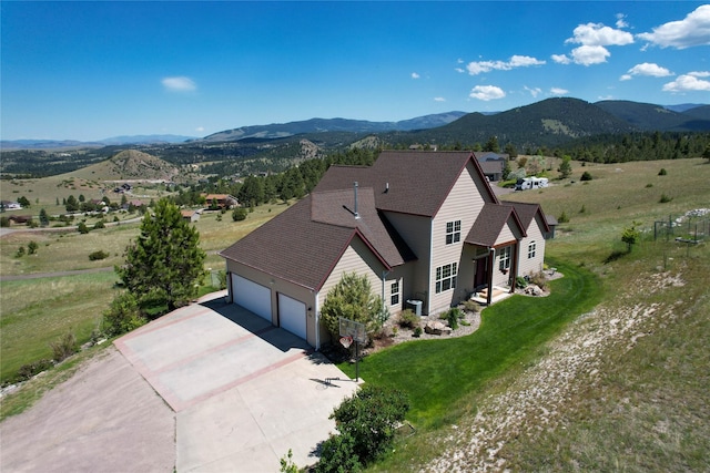 drone / aerial view featuring a mountain view