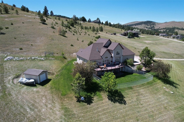 birds eye view of property featuring a mountain view and a rural view