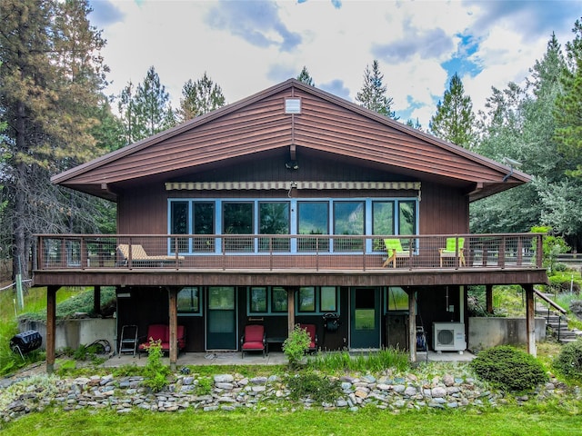 back of house with ac unit, a patio, and a wooden deck