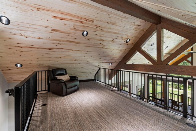 unfurnished room with carpet, high vaulted ceiling, beamed ceiling, and wooden ceiling