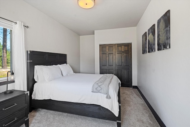 carpeted bedroom featuring a closet