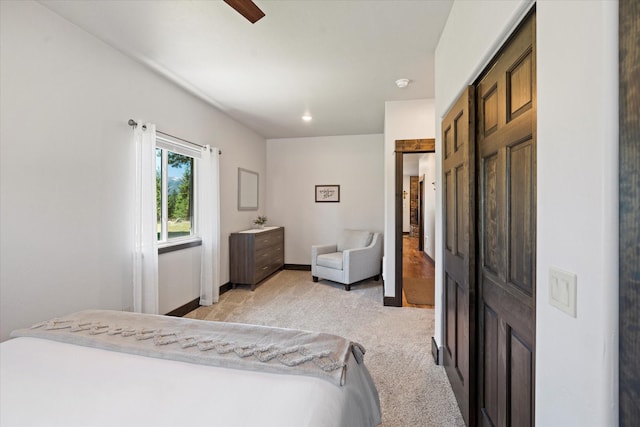 carpeted bedroom with ceiling fan