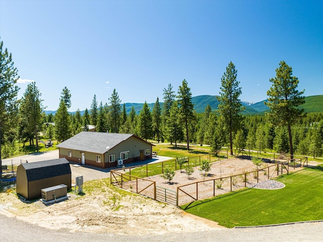 birds eye view of property featuring a rural view and a mountain view