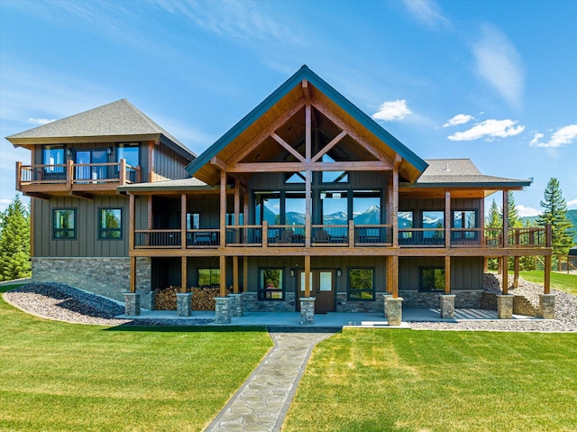 rear view of house with a patio area and a yard