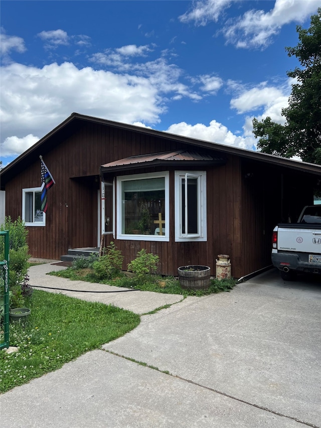 view of front of home featuring an attached carport