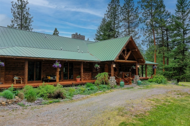 log-style house with a porch