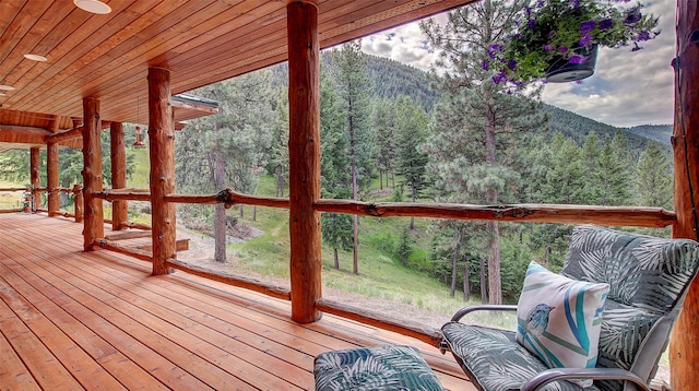 wooden terrace with a mountain view