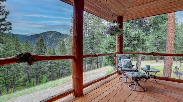 wooden terrace with a mountain view