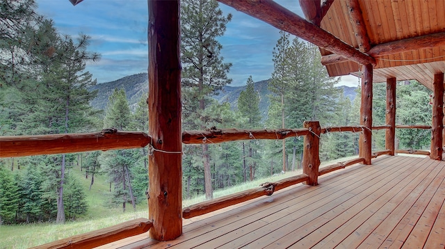 wooden deck featuring a mountain view