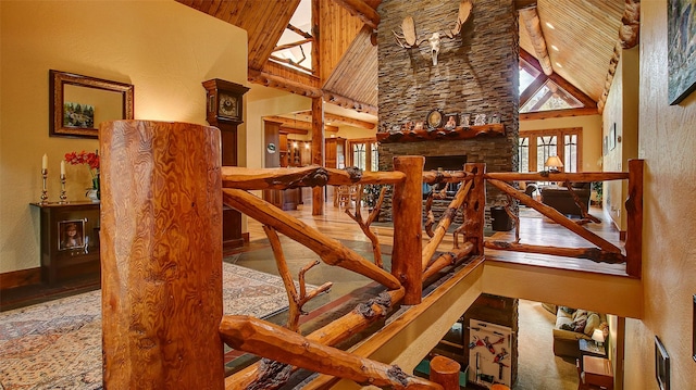 stairway featuring high vaulted ceiling and wood-type flooring