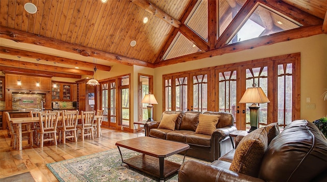 living room with beam ceiling, french doors, high vaulted ceiling, wood ceiling, and light wood-type flooring