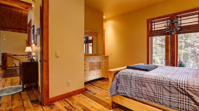 bedroom with hardwood / wood-style flooring