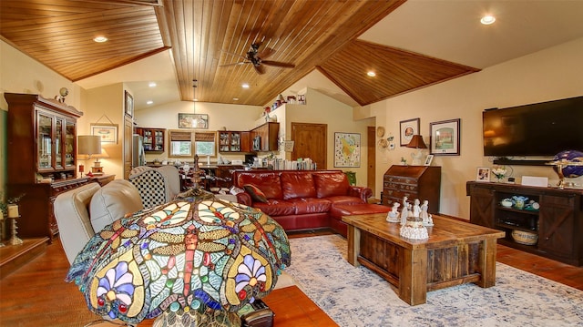 living room featuring ceiling fan, wood ceiling, and lofted ceiling