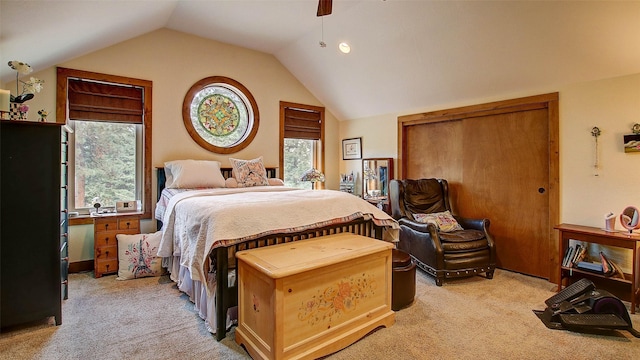 carpeted bedroom with ceiling fan and lofted ceiling