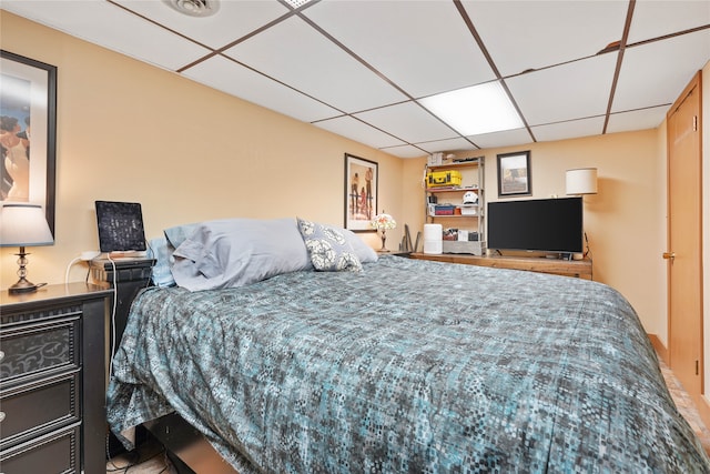 bedroom with a drop ceiling