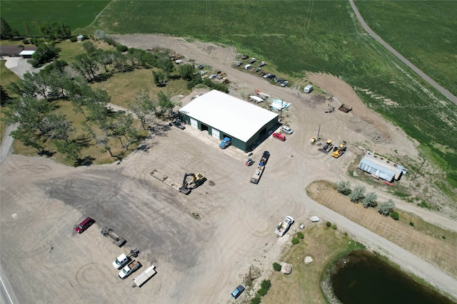 birds eye view of property with a rural view