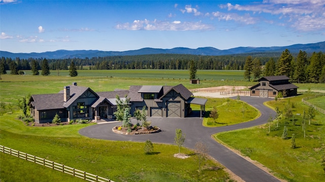 drone / aerial view with a mountain view and a rural view