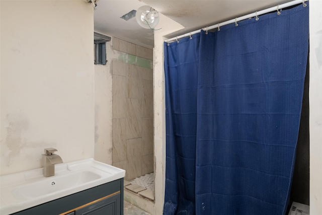 bathroom with vanity and walk in shower